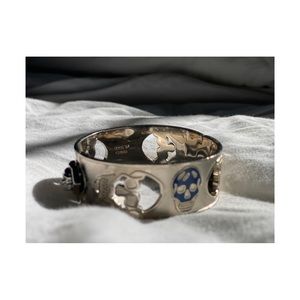 Authentic Alexander McQueen skull blue and silver bangle bracelet